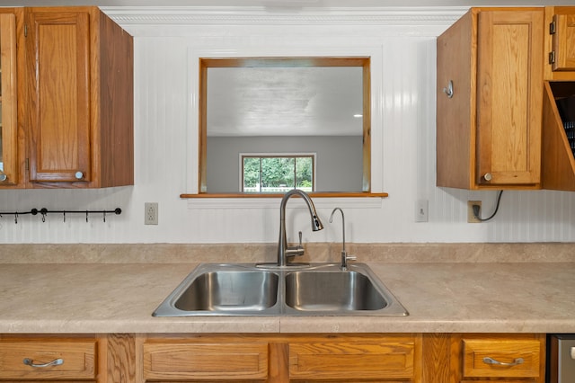 1402 Gracel St, Jackson, MI 49202 - kitchen featuring light countertops and brown cabinets