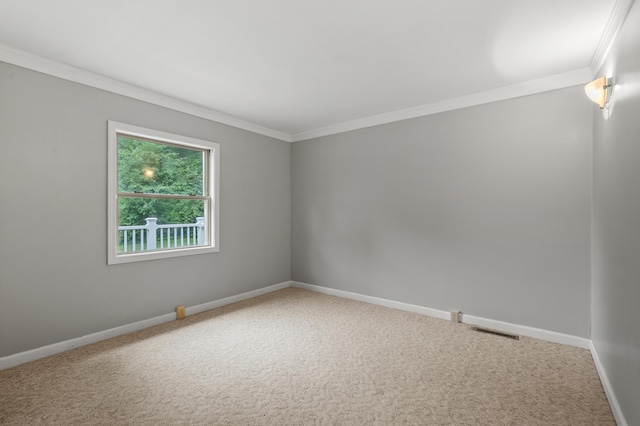 1402 Gracel St, Jackson, MI 49202 - carpeted empty room with crown molding and baseboards