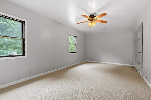 1402 Gracel St, Jackson, MI 49202 - unfurnished room featuring light carpet and a ceiling fan