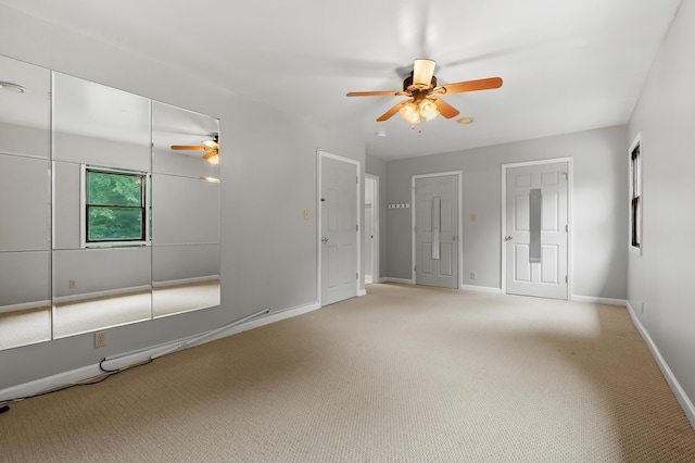 1402 Gracel St, Jackson, MI 49202 - unfurnished room featuring ceiling fan and light carpet