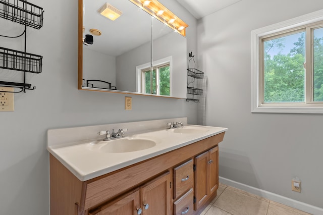 1402 Gracel St, Jackson, MI 49202 - full bathroom featuring plenty of natural light, double vanity, and tile patterned floors