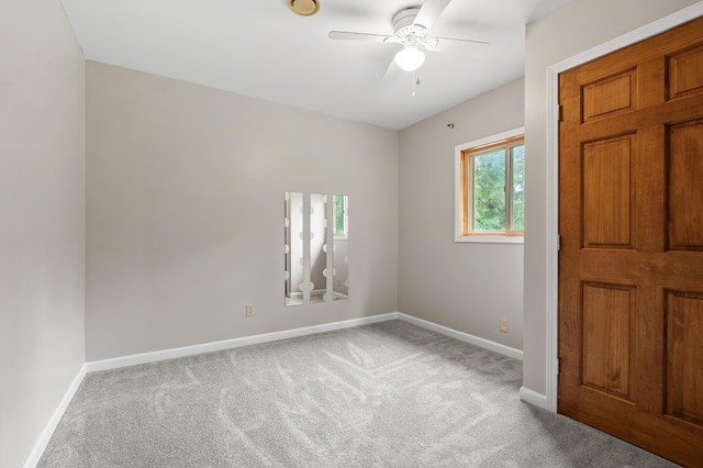 1402 Gracel St, Jackson, MI 49202 - spare room featuring carpet and a ceiling fan
