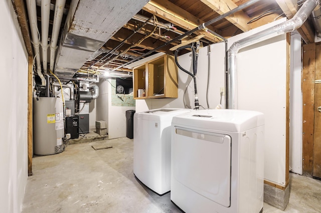 1402 Gracel St, Jackson, MI 49202 - laundry area with gas water heater and washer and clothes dryer