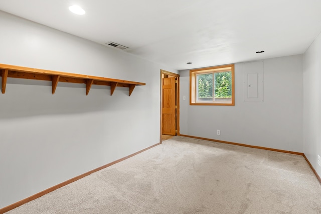 1402 Gracel St, Jackson, MI 49202 - unfurnished bedroom with light carpet, electric panel, and recessed lighting