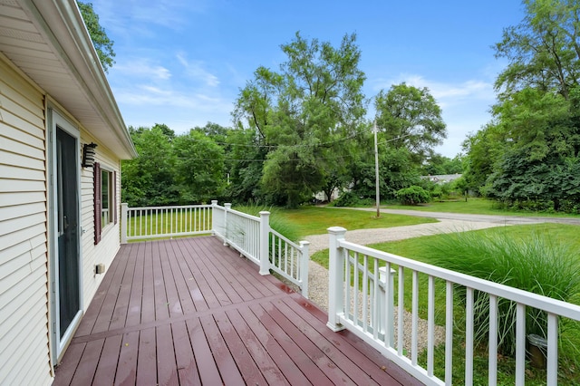 1402 Gracel St, Jackson, MI 49202 - wooden terrace with a yard