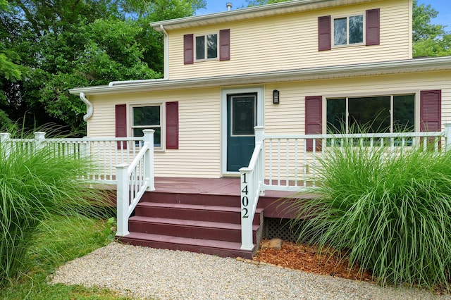 1402 Gracel St, Jackson, MI 49202 - view of front of house with a wooden deck