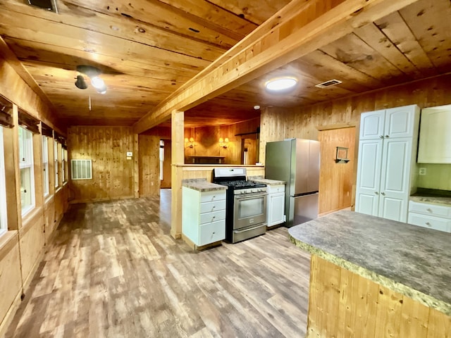 18572 Oxbow Dr, Barryton, MI 49305 - kitchen featuring stainless steel appliances, wood ceiling, light wood-style floors, and wooden walls