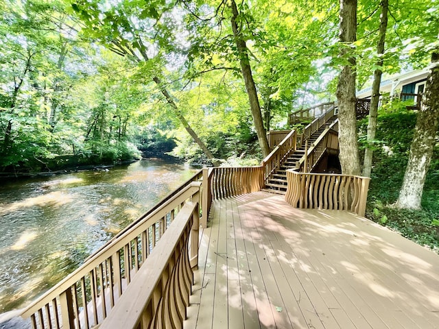 18572 Oxbow Dr, Barryton, MI 49305 - deck with stairs and a water view