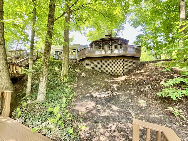 18572 Oxbow Dr, Barryton, MI 49305 - view of yard with a deck and stairway