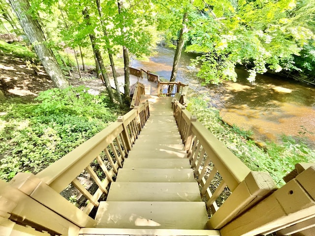 18572 Oxbow Dr, Barryton, MI 49305 - staircase featuring a water view