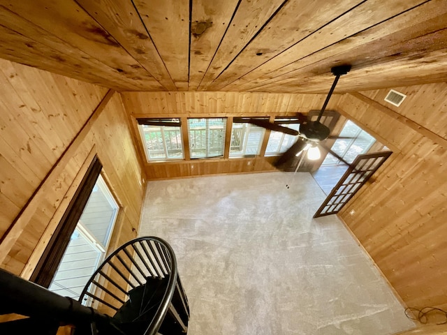 18572 Oxbow Dr, Barryton, MI 49305 - unfurnished living room with wooden walls, wood ceiling, plenty of natural light, and ceiling fan