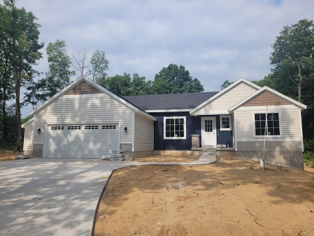36 S Yankee Springs Rd, Middleville, MI 49333 - view of front of property featuring a garage and concrete driveway