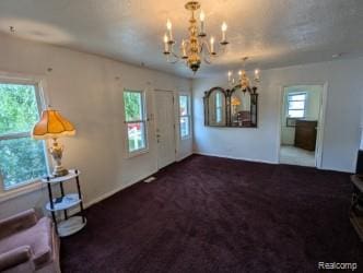 61 W End Ave, Waterford, MI 48328 - entryway featuring a chandelier and carpet floors