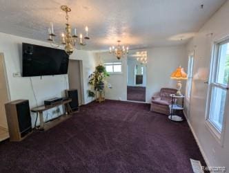 61 W End Ave, Waterford, MI 48328 - carpeted living room with a chandelier and baseboards