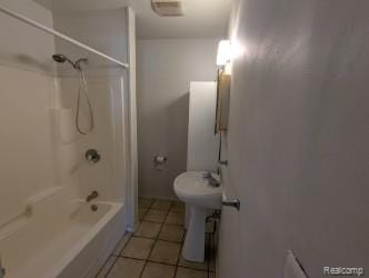 61 W End Ave, Waterford, MI 48328 - full bathroom with tile patterned floors and  shower combination