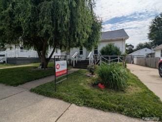 61 W End Ave, Waterford, MI 48328 - view of front of property featuring driveway and covered porch