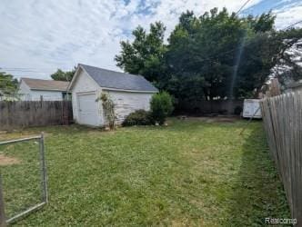 61 W End Ave, Waterford, MI 48328 - fenced backyard with a storage shed