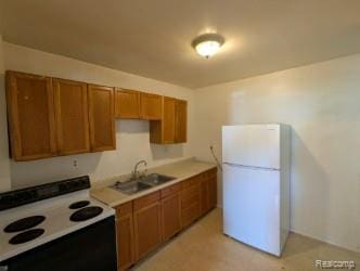61 W End Ave, Waterford, MI 48328 - kitchen featuring white appliances, brown cabinetry, and light countertops