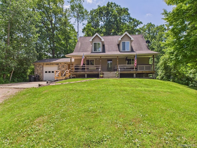 193 Miller Lake Rd, Columbiaville, MI 48421 - view of front of home with a porch, concrete driveway, an attached garage, and a front lawn
