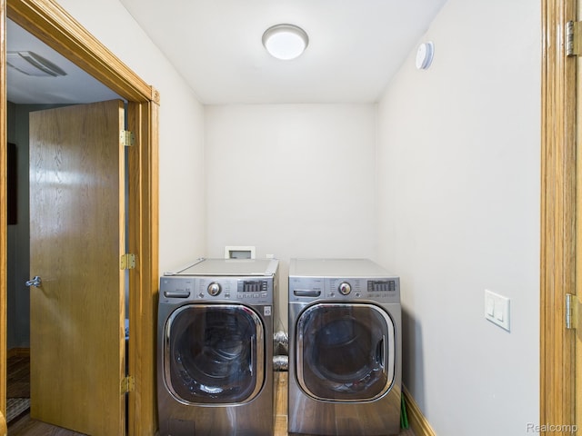 193 Miller Lake Rd, Columbiaville, MI 48421 - laundry room with washing machine and clothes dryer