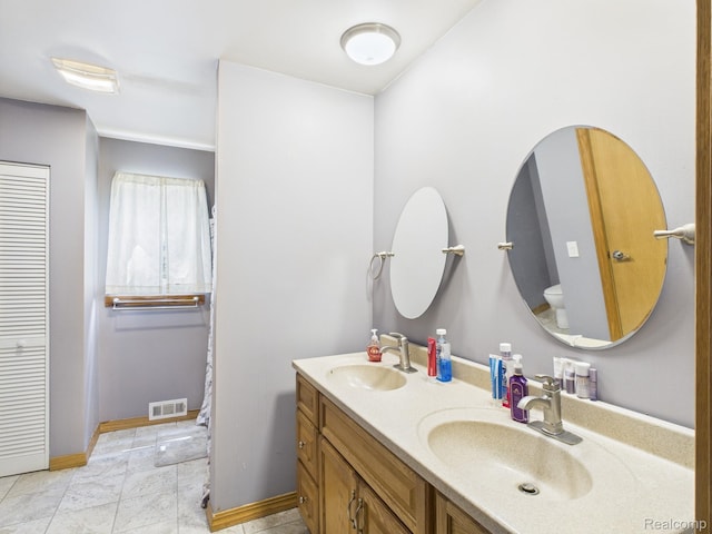 193 Miller Lake Rd, Columbiaville, MI 48421 - bathroom featuring toilet and double vanity