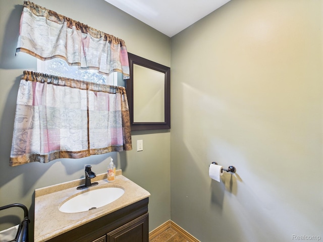 193 Miller Lake Rd, Columbiaville, MI 48421 - bathroom with wood finished floors and vanity