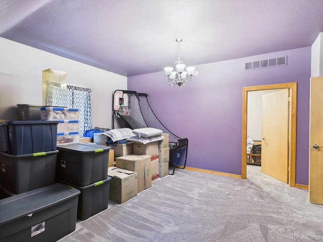 193 Miller Lake Rd, Columbiaville, MI 48421 - carpeted bedroom with a chandelier and a textured ceiling