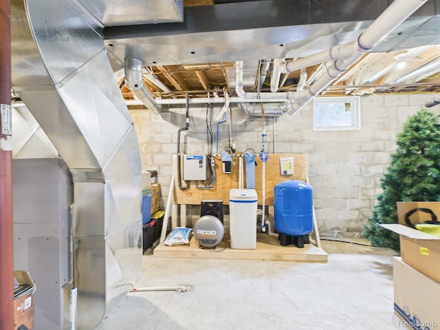 193 Miller Lake Rd, Columbiaville, MI 48421 - below grade area with a water pressure tank, heating unit, and a water softener
