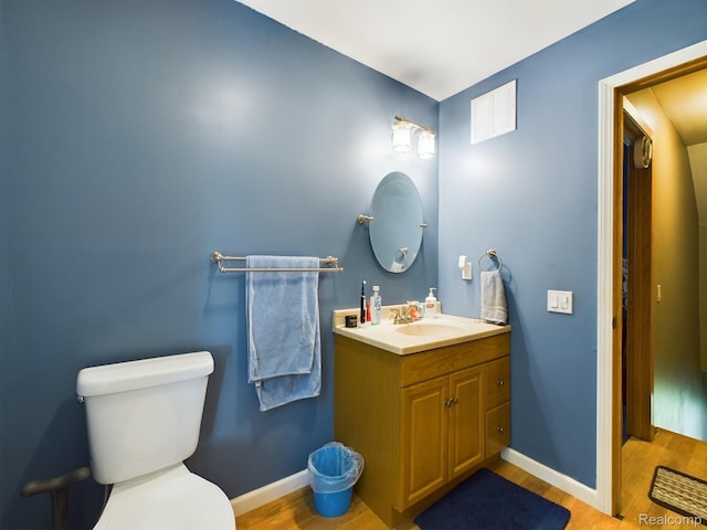 193 Miller Lake Rd, Columbiaville, MI 48421 - bathroom with vanity and wood finished floors
