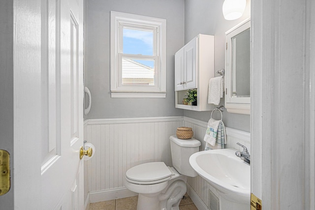 256 Nichols Dr, Saline, MI 48176 - half bath featuring a wainscoted wall and tile patterned flooring