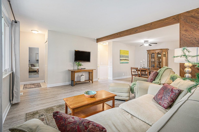 256 Nichols Dr, Saline, MI 48176 - living room with wood finished floors, a ceiling fan, and beam ceiling