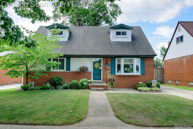 13620 Aston St, Romulus, MI 48174 - cape cod-style house featuring brick siding, a front yard, a chimney, and roof with shingles