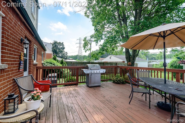 13620 Aston St, Romulus, MI 48174 - wooden terrace with grilling area and outdoor dining space