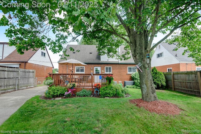 13620 Aston St, Romulus, MI 48174 - back of property featuring brick siding and a deck