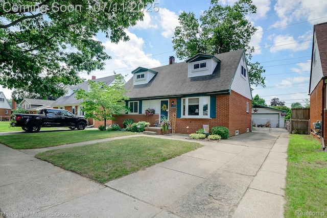 13620 Aston St, Romulus, MI 48174 - cape cod home with brick siding, a front yard, an outdoor structure, a garage, and a shingled roof