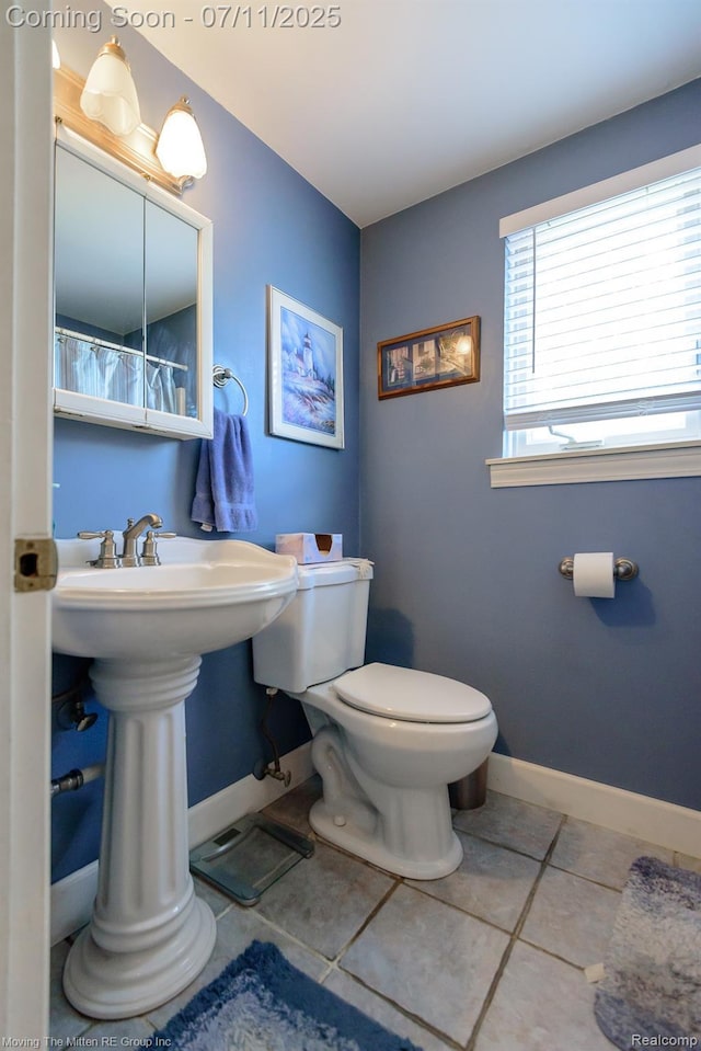 13620 Aston St, Romulus, MI 48174 - bathroom with toilet and tile patterned flooring