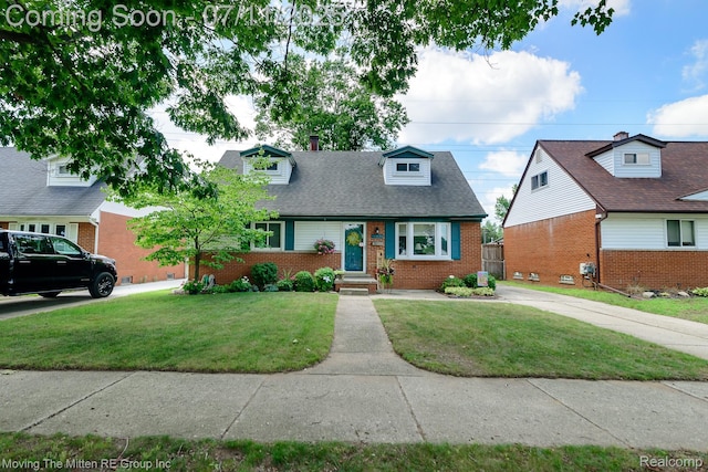 13620 Aston St, Romulus, MI 48174 - cape cod-style house with brick siding and a front lawn