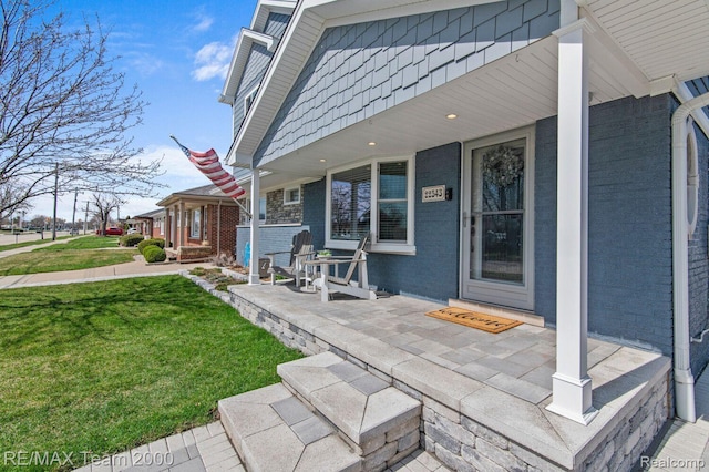 22543 E 11 Mile Rd, Saint Clair Shores, MI 48081 - covered porch with a yard