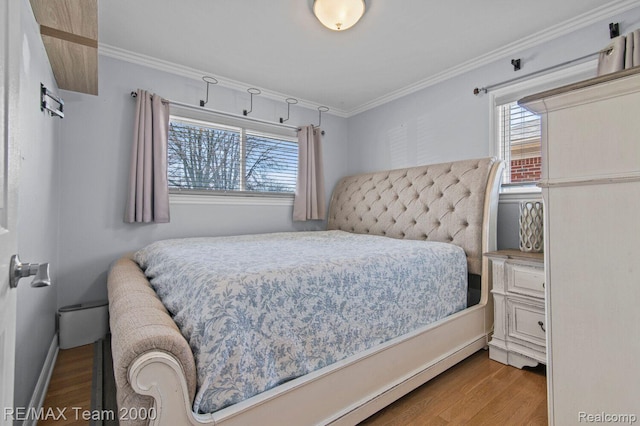 22543 E 11 Mile Rd, Saint Clair Shores, MI 48081 - bedroom featuring wood finished floors, multiple windows, and ornamental molding