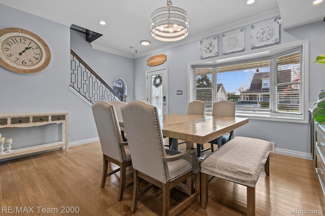 22543 E 11 Mile Rd, Saint Clair Shores, MI 48081 - dining room with a chandelier, crown molding, recessed lighting, light wood-style flooring, and stairway