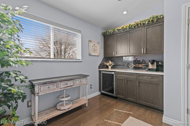 22543 E 11 Mile Rd, Saint Clair Shores, MI 48081 - indoor bar with beverage cooler, dark wood finished floors, lofted ceiling, and recessed lighting