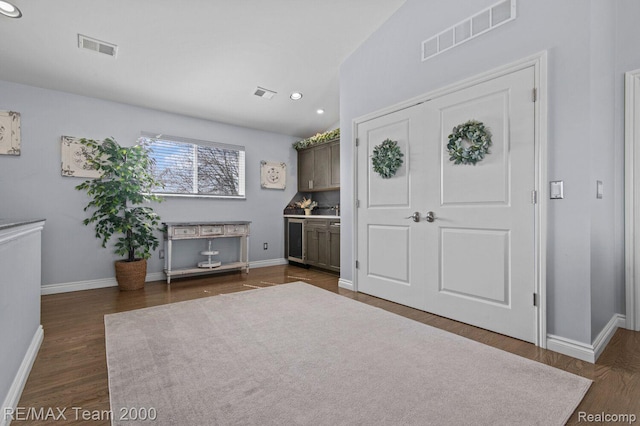 22543 E 11 Mile Rd, Saint Clair Shores, MI 48081 - entrance foyer with beverage cooler and dark wood-type flooring