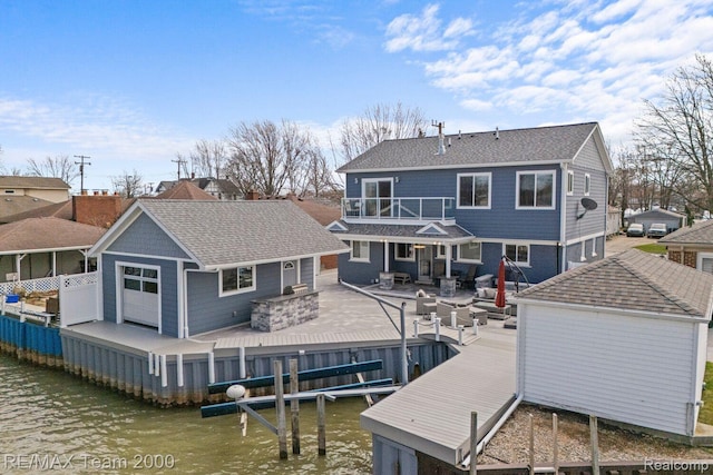 22543 E 11 Mile Rd, Saint Clair Shores, MI 48081 - back of property featuring a balcony, a patio, and roof with shingles