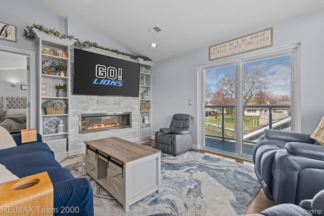 22543 E 11 Mile Rd, Saint Clair Shores, MI 48081 - living area with lofted ceiling, a fireplace, built in features, and recessed lighting
