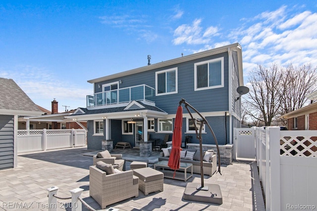 22543 E 11 Mile Rd, Saint Clair Shores, MI 48081 - back of house featuring a balcony, outdoor lounge area, a gate, a fenced backyard, and a patio