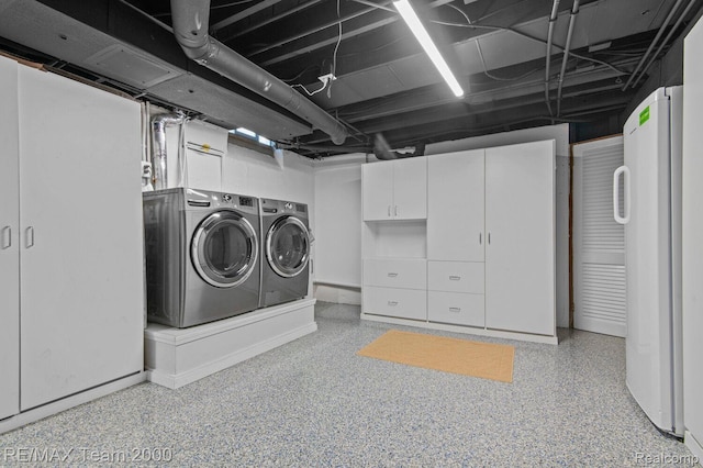22543 E 11 Mile Rd, Saint Clair Shores, MI 48081 - laundry room with washer and clothes dryer and cabinet space