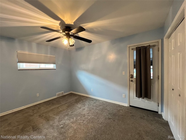 4436 Tulane St, Dearborn Heights, MI 48125 - spare room featuring dark colored carpet and ceiling fan