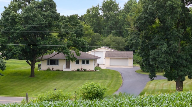 2230 Oleary Rd, Jackson, MI 49201 - ranch-style house featuring a detached garage, a front lawn, and an outbuilding