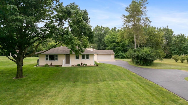 2230 Oleary Rd, Jackson, MI 49201 - ranch-style house with a garage and a front yard