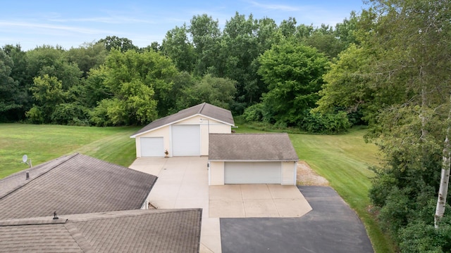 2230 Oleary Rd, Jackson, MI 49201 - view of patio featuring an outdoor structure and a garage